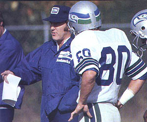 Seattle Seahawks receiver Steve Largent (80) hugs quarterback Dave Krieg on  the sidelines at Riverfront Stadium in Cincinnati during their game with  the Cincinnati Bengals, Dec. 11, 1989. Largent had just caught